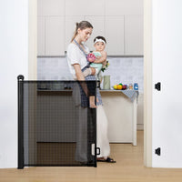 COMOMY Retractable Baby Gate for Stairs, 0-140cm Mesh Dog Gate for House Doorways Hallways, 84cm Tall Extra Wide Child Safety Gate for Kids Pets, Indoor and Outdoor (Black)